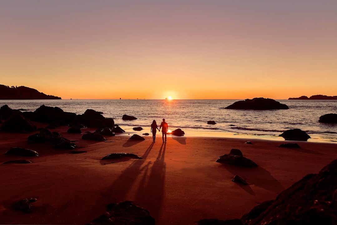 romantic couple on beach at sunset